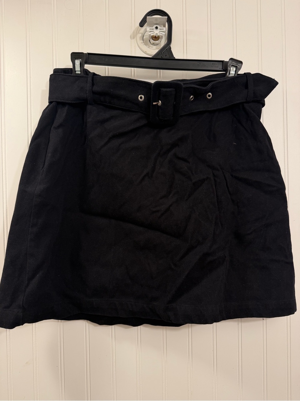 belted black mini skirt